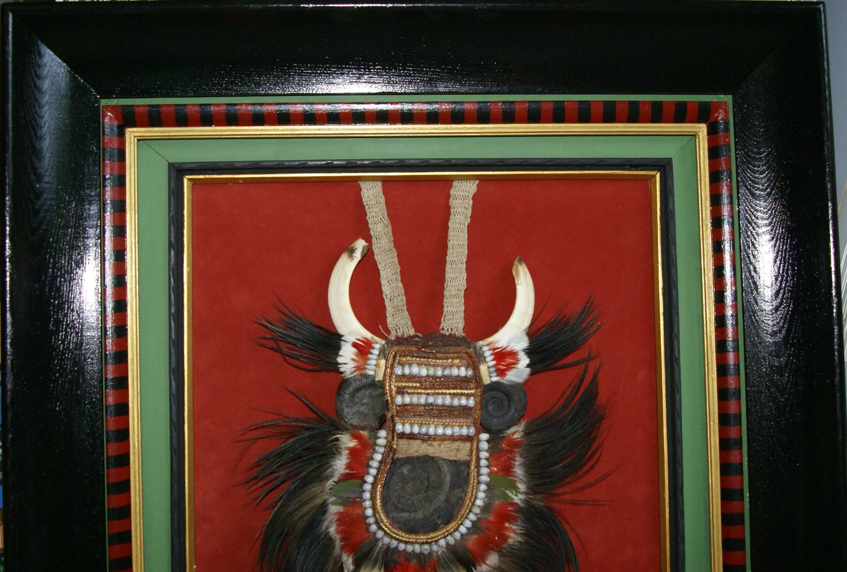 Rare Body Art : Dani “Big Man” Pectoral Trophy, Bride Price, Currency, Feud Payment, Highly Collectible: Ammonite, Boar Tusks, Cassowary, Seed beads, Bark Twine etc… Custom framed, 28” x 24 ½”, Collected in the late 1900’s. Museum Quality, New Guinea.